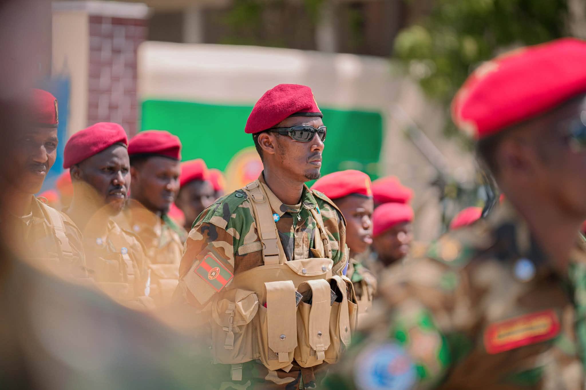 A Somali National Army soldier stands in formation with fellow troops during a military gathering in Mogadishu. Government forces have stepped up operations targeting Al-Shabaab militants.