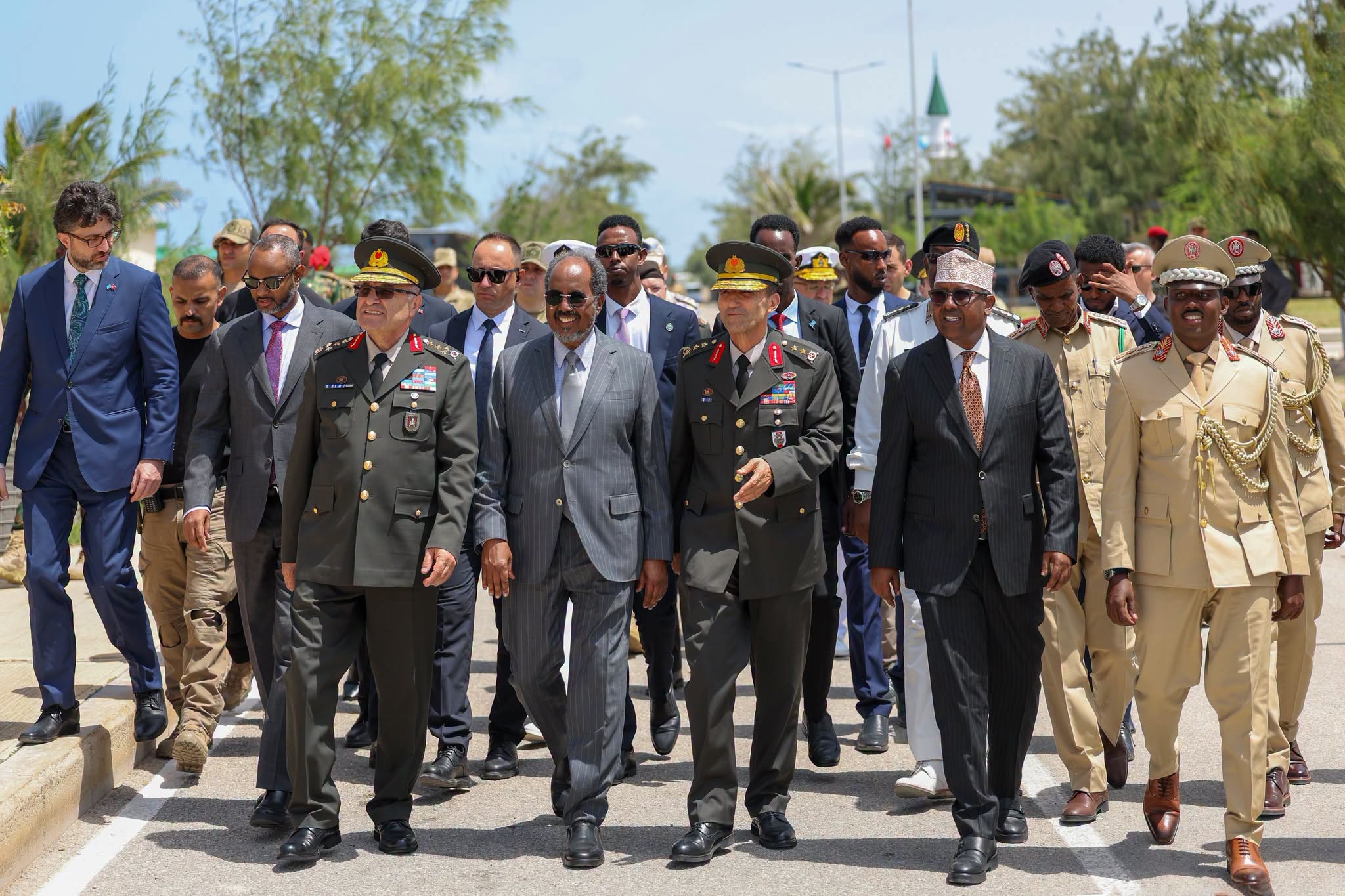 Somali President Hassan Sheikh Mohamud arrives at the graduation ceremony for newly commissioned Somali National Army officers and deputy officers at the TURKSOM Military Training Academy in Mogadishu, where he presided over the event and congratulated the graduates on completing their military training.