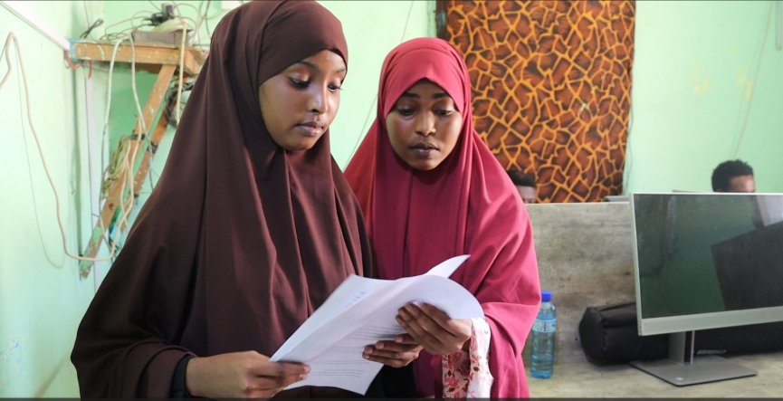 Hamdi Hassan (left), and her colleague Shukri Caabi Abdi (right, who work for Radio Risaala. Both were trained under the auspices of an SJS program, generously supported by the Canadian Fund for Local Initiatives (CFLI) pictured in the Risaala Radio studio on 13 February, 2024. | PHOTO/SJS